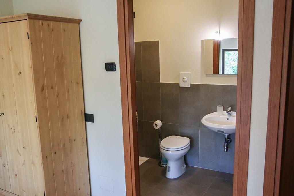 Oasi Hostel Merone Pokoj fotografie