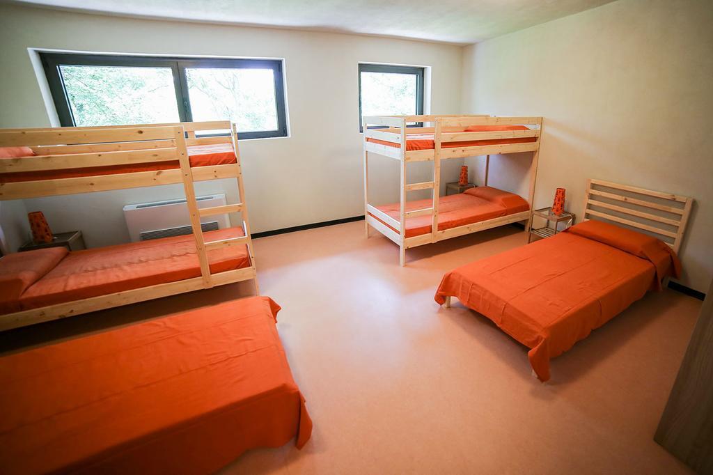 Oasi Hostel Merone Pokoj fotografie