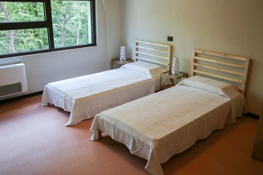Oasi Hostel Merone Pokoj fotografie